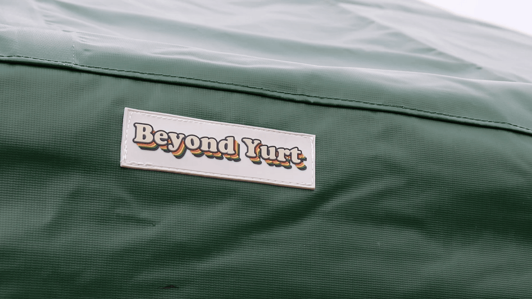 Close-up of a green fabric surface with 'Beyond Yurt' label.