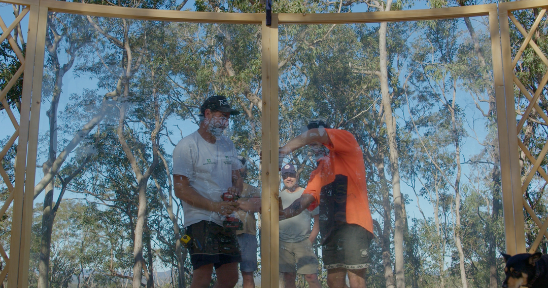 Huge curved yurt windows being installed to frame amazing view