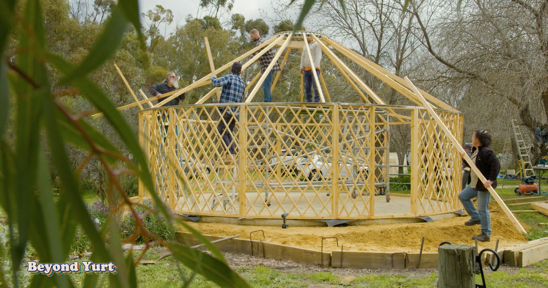 Yurt centre ring and rafters being installed on a 7 metre yurt
