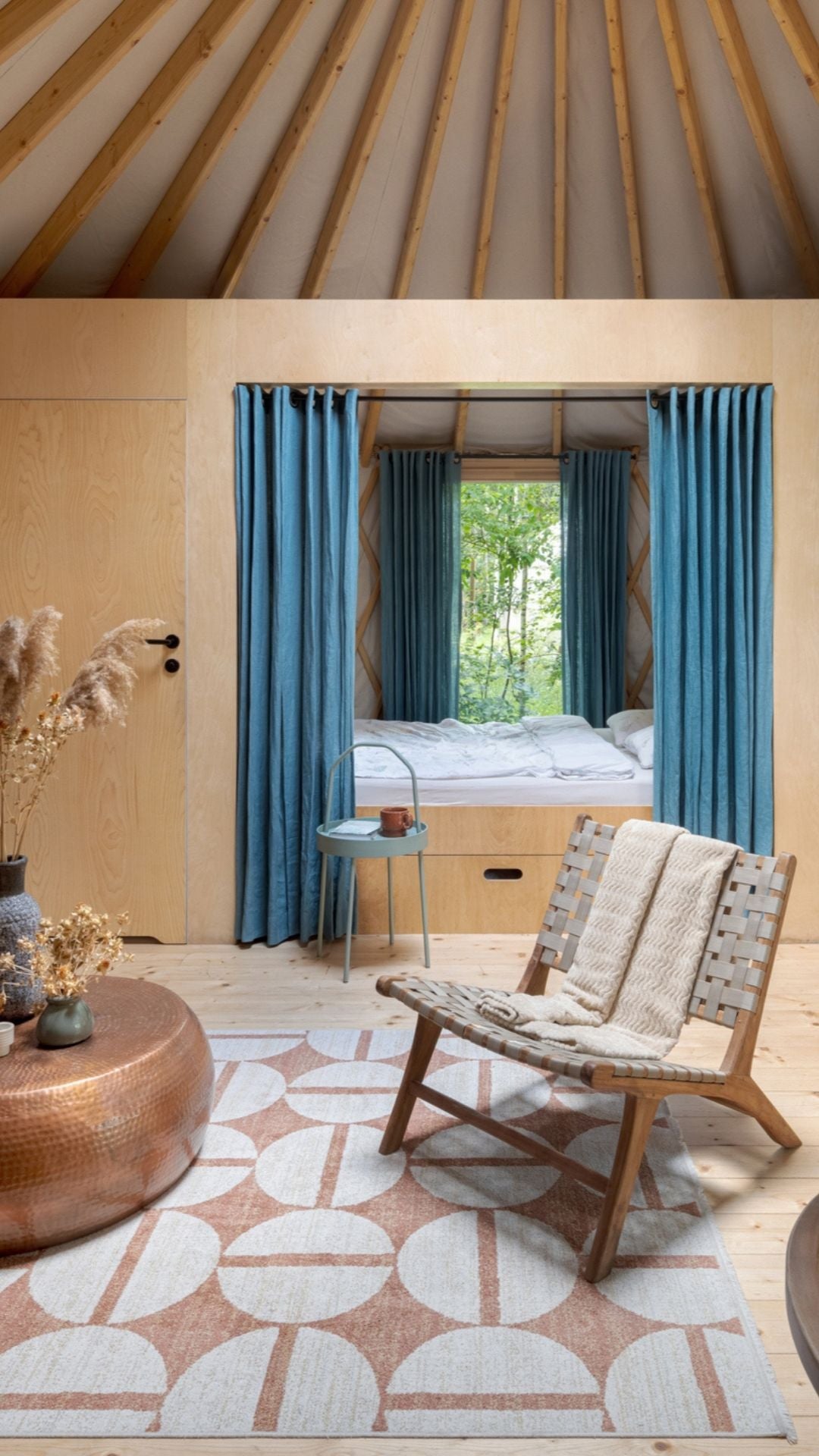 Styled yurt interior with furniture, lounge seating and soft lighting designed for comfortable everyday living