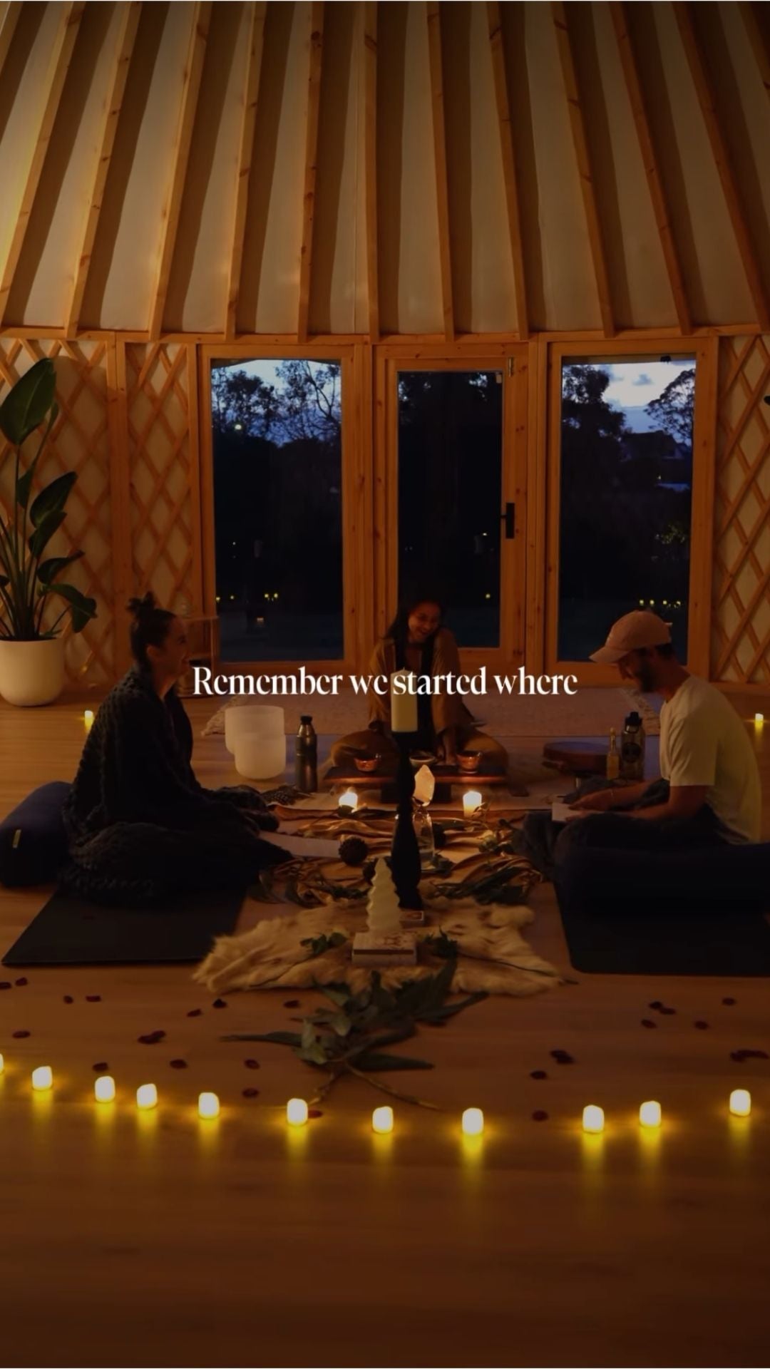 Interior of a yurt at dusk with warm lighting, creating a calm and private space for relaxation or focused use