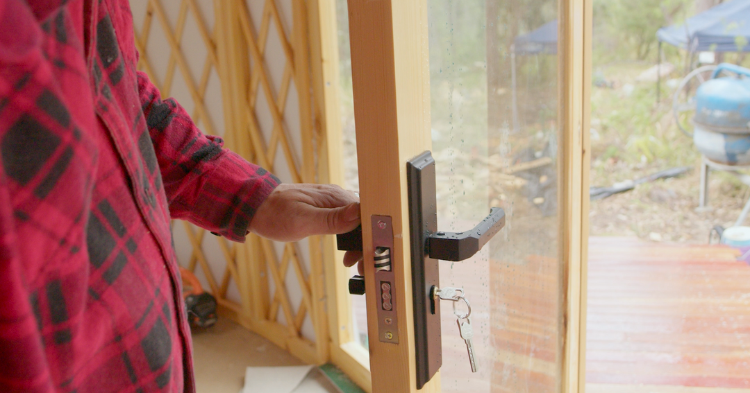 Yurt doors with black handles, keys and lock