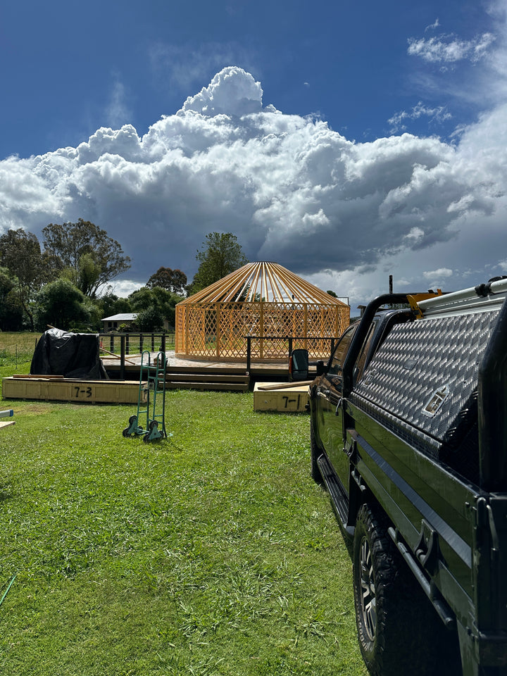 Yurt frame erected on wooden deck