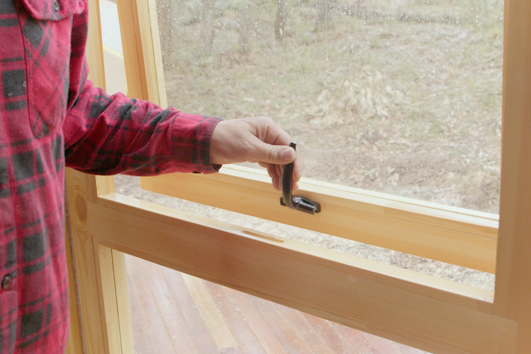 Yurt windows being opened with black premium handles