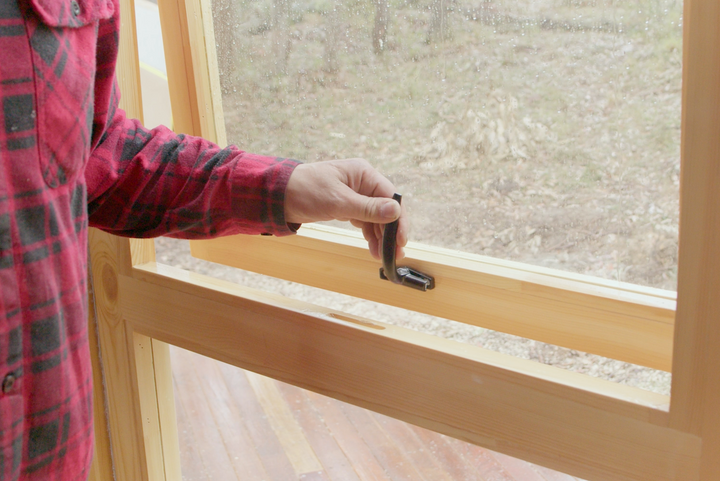 Yurt windows being opened with black premium handles